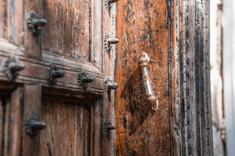 Mezuzah is attached to a wooden antique door.